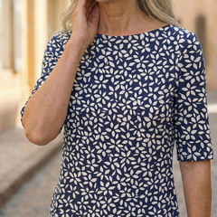 Blue patterned dress close-up with round neckline and short sleeves
