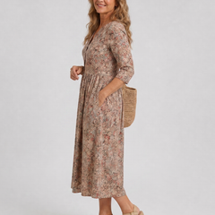 Beige floral midi dress in side view with V-neck and three-quarter sleeves