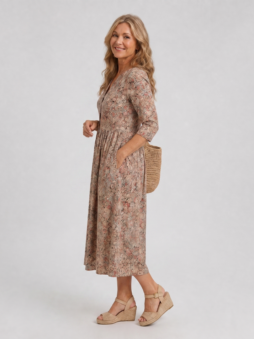 Beige floral midi dress in side view with V-neck and three-quarter sleeves