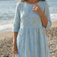 Sky blue leaf-pattern midi dress with round neckline, three-quarter sleeves, gathered waist detail