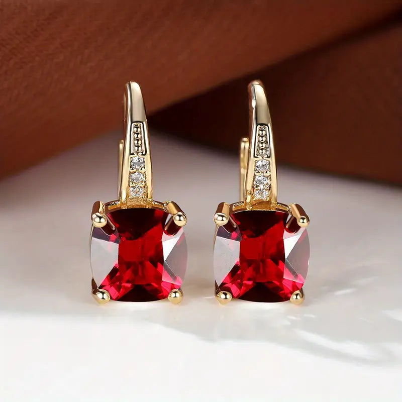 Gold hoop earrings with ruby-red square stones