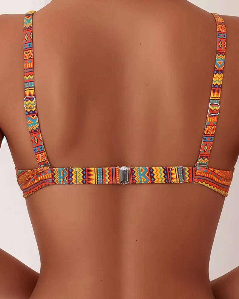 Back view of orange striped bikini top with racerback straps and metal center clasp