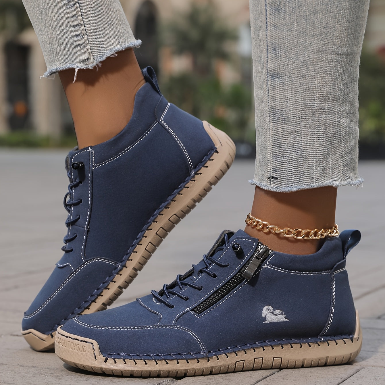 Navy zip-up comfort shoes with lace-up eyelets, side zipper tab, and stitched outsole
