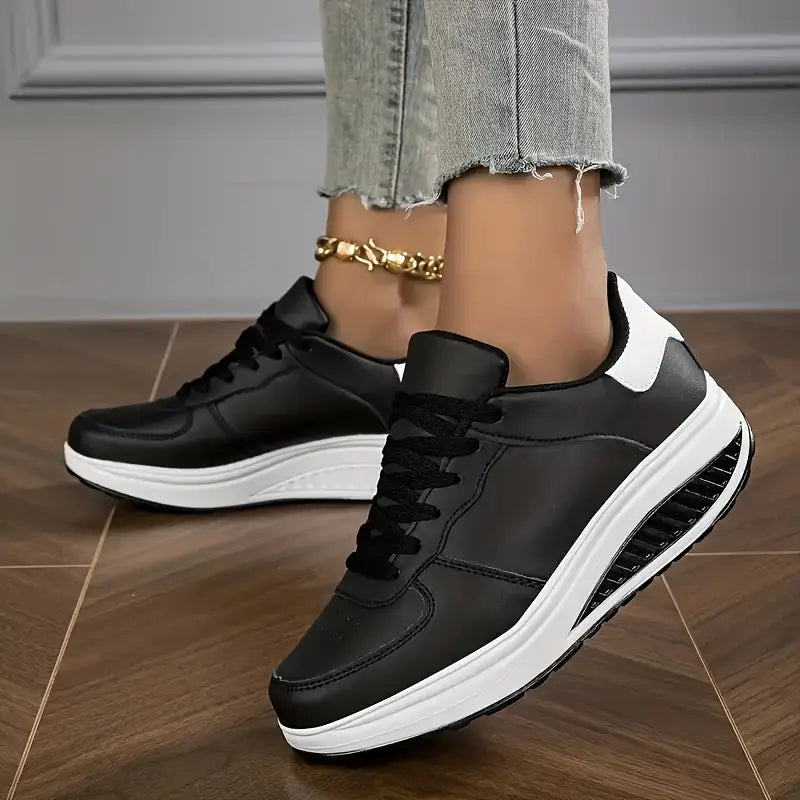 Black lace-up platform comfort sneakers with white stripe on the side