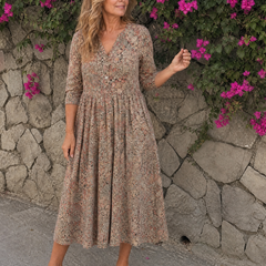 Beige floral midi dress with V-neck and three-quarter sleeves, full pleated skirt