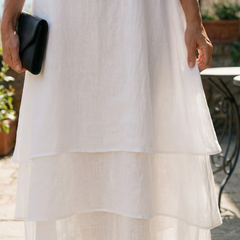 White layered midi skirt with tiered ruffle levels and lightweight fabric