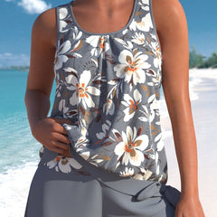 Grey tankini set with white and orange floral print and matching swim shorts