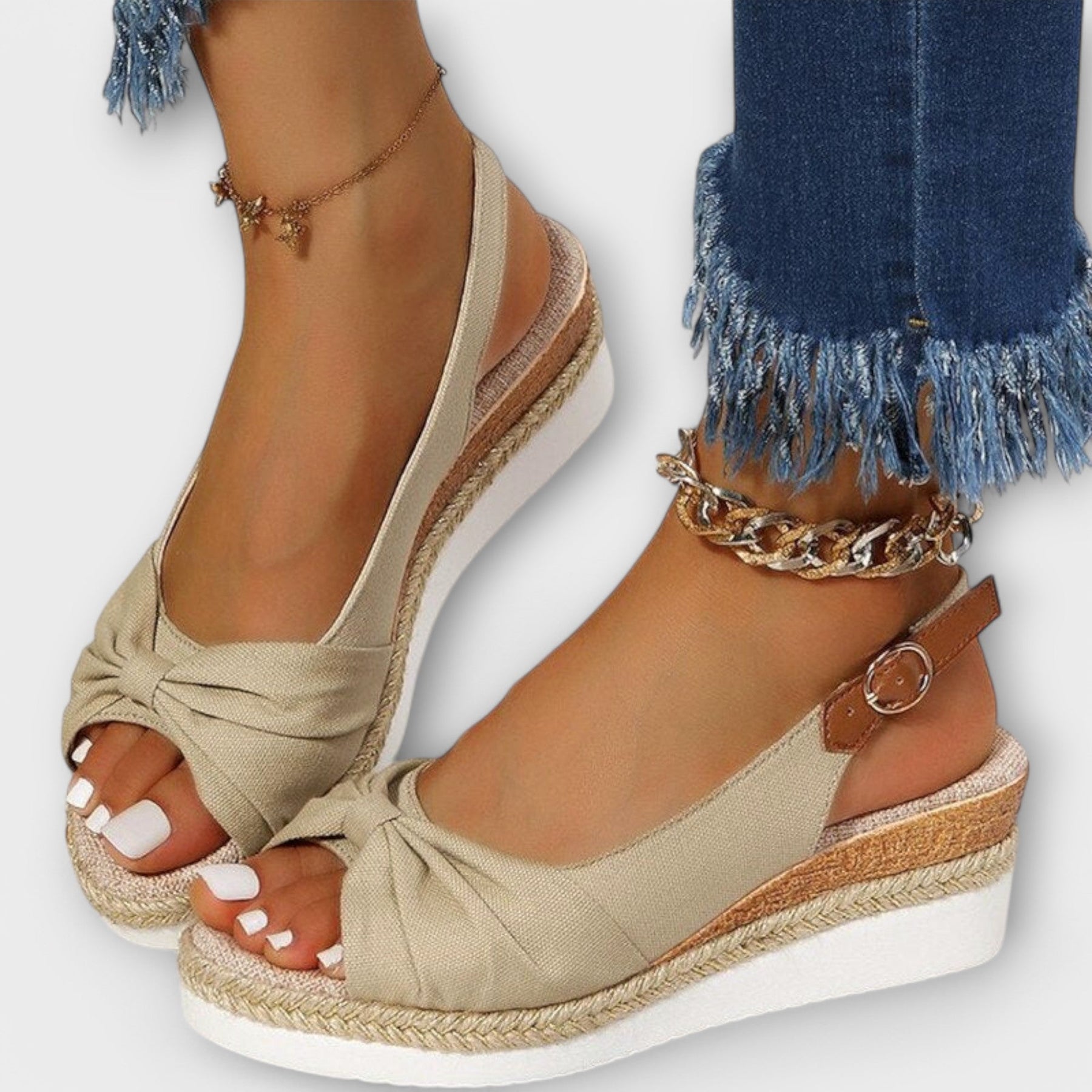 Beige espadrille wedge sandals with knotted strap front and open toe