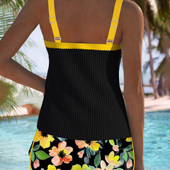 Back view of two-piece tankini set: black tank with yellow straps, floral shorts