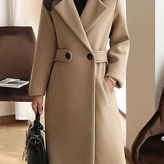Camel beige long overcoat with notched lapels, front buttons, and tied waist belt