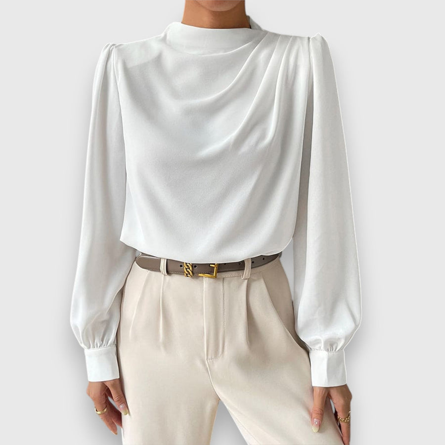 White long-sleeve blouse with high neck, cuffed sleeves, and draped front