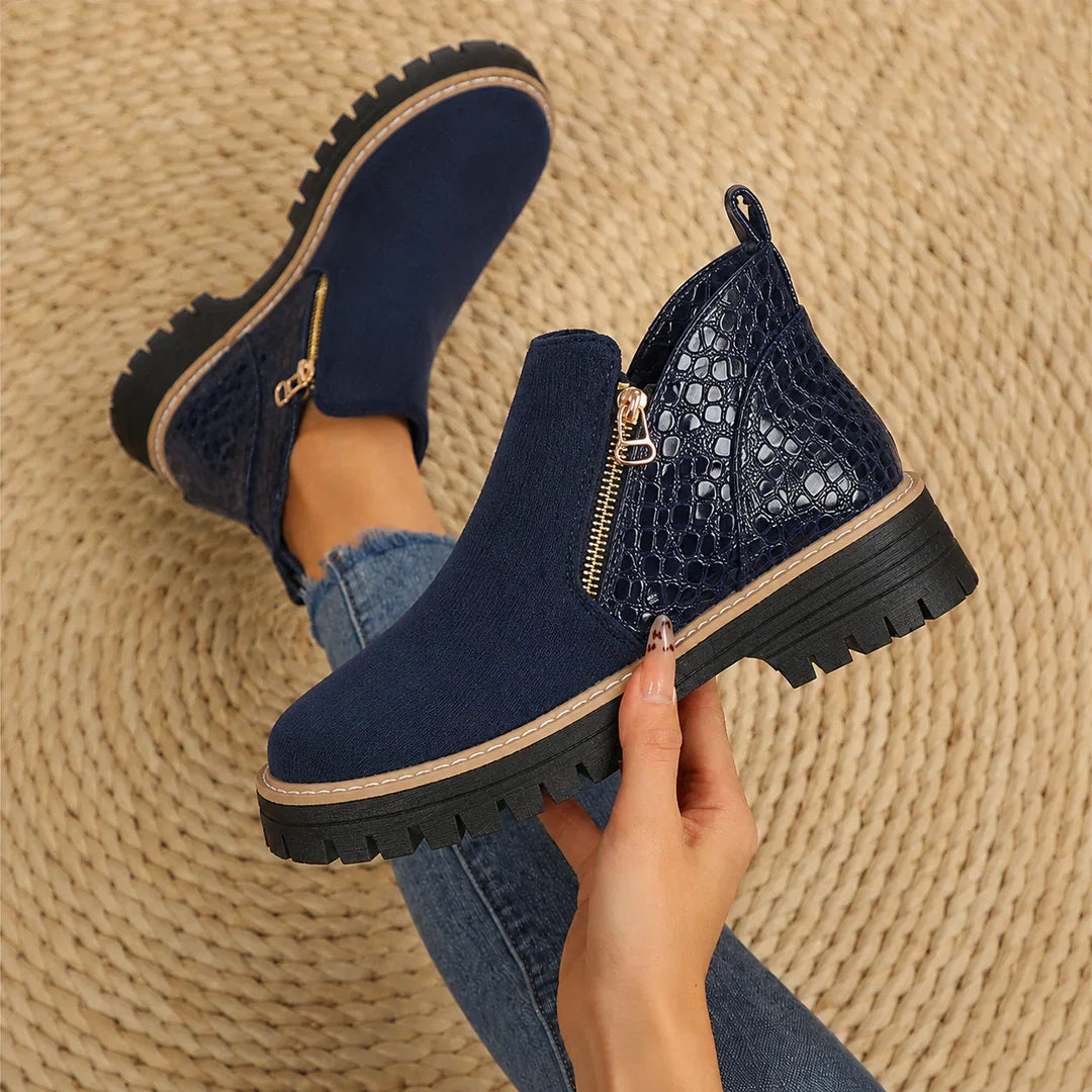 Women's ankle boots in dark blue with croc-look side panel and gold zip