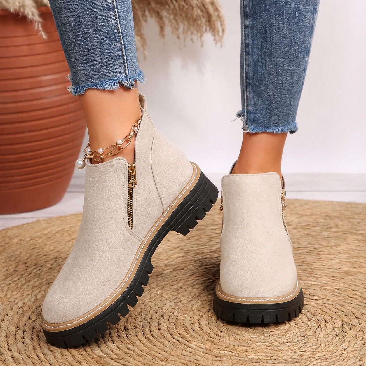 Women's ankle boots, beige suede-look with side zipper and chunky lug sole.