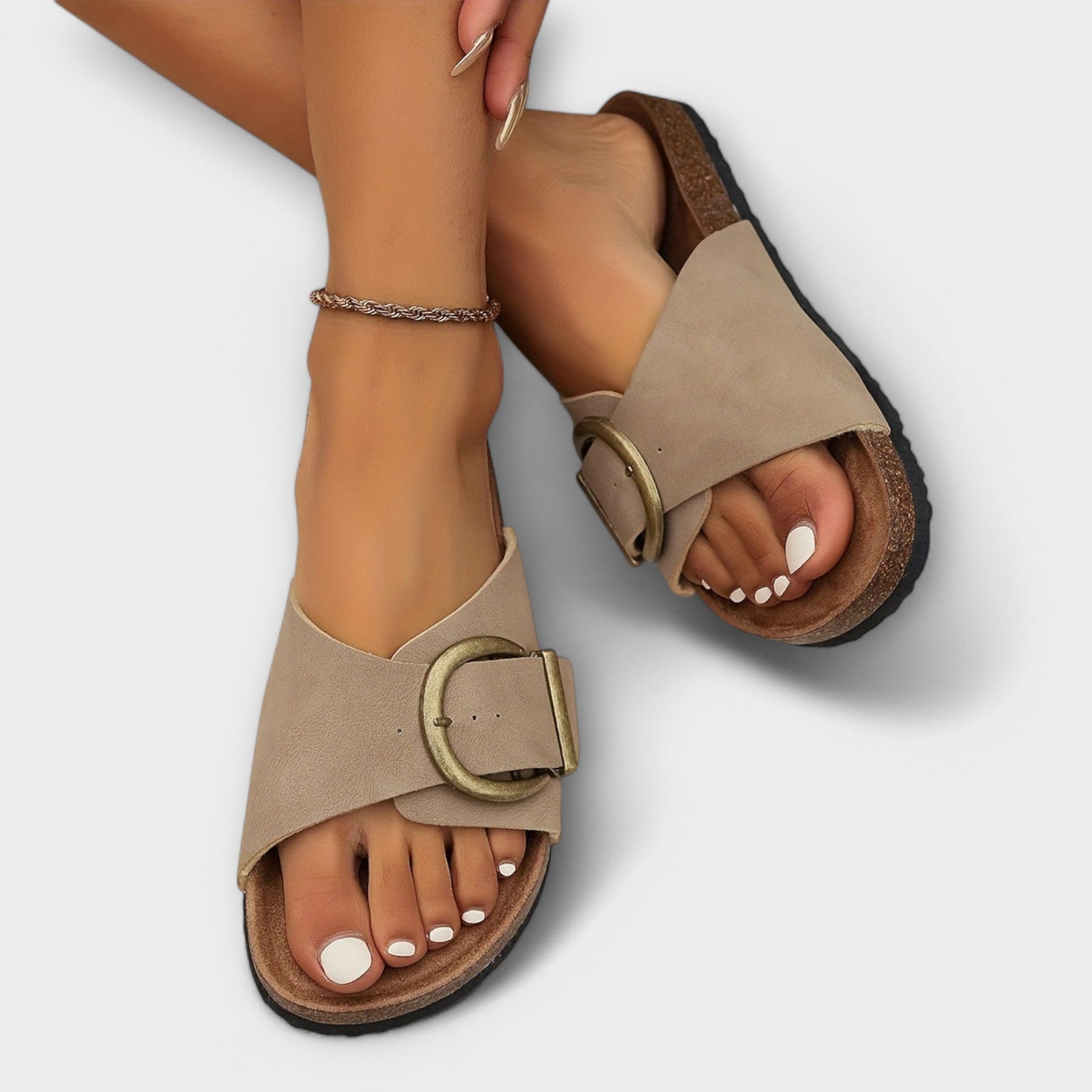 Beige soft-glide sandals with gold buckle, open toe and cork footbed