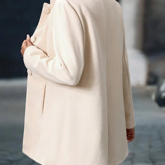 Cream back view coat with rounded button details and long sleeves