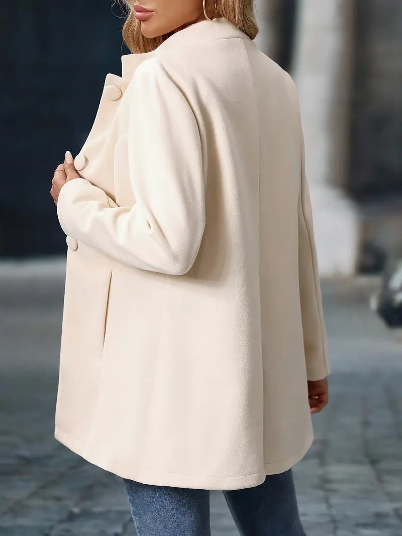 Cream back view coat with rounded button details and long sleeves