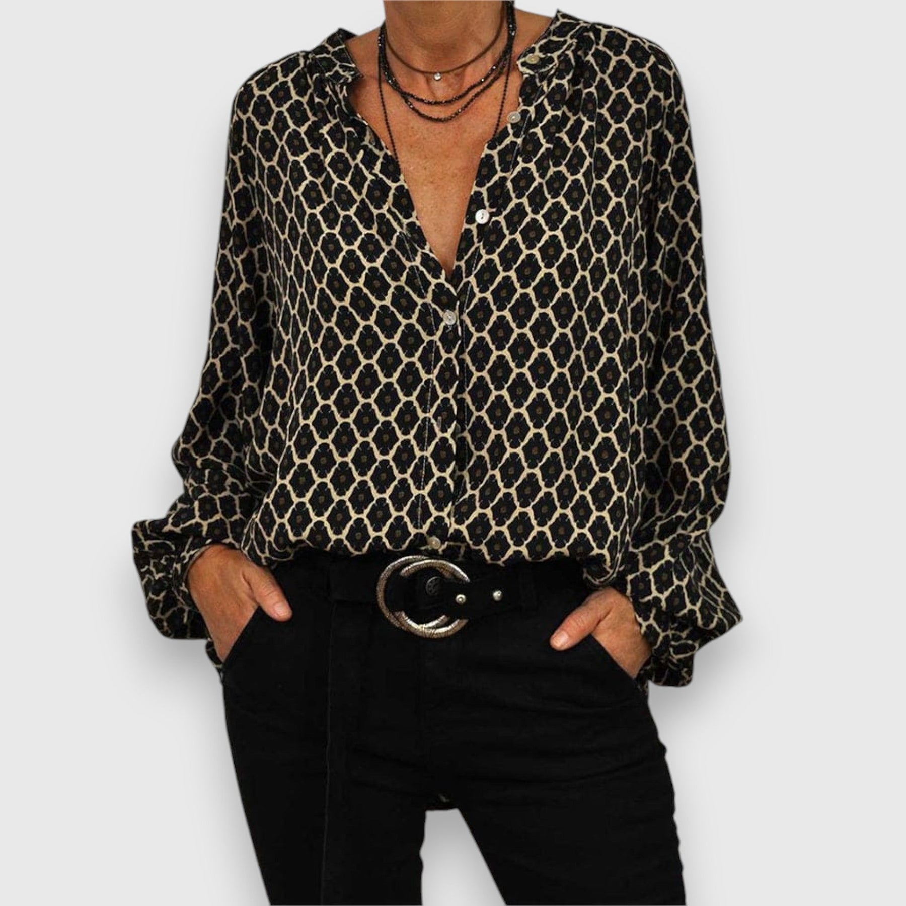 Long-sleeve blouse with black-and-gold geometric pattern, V-neck, relaxed fit