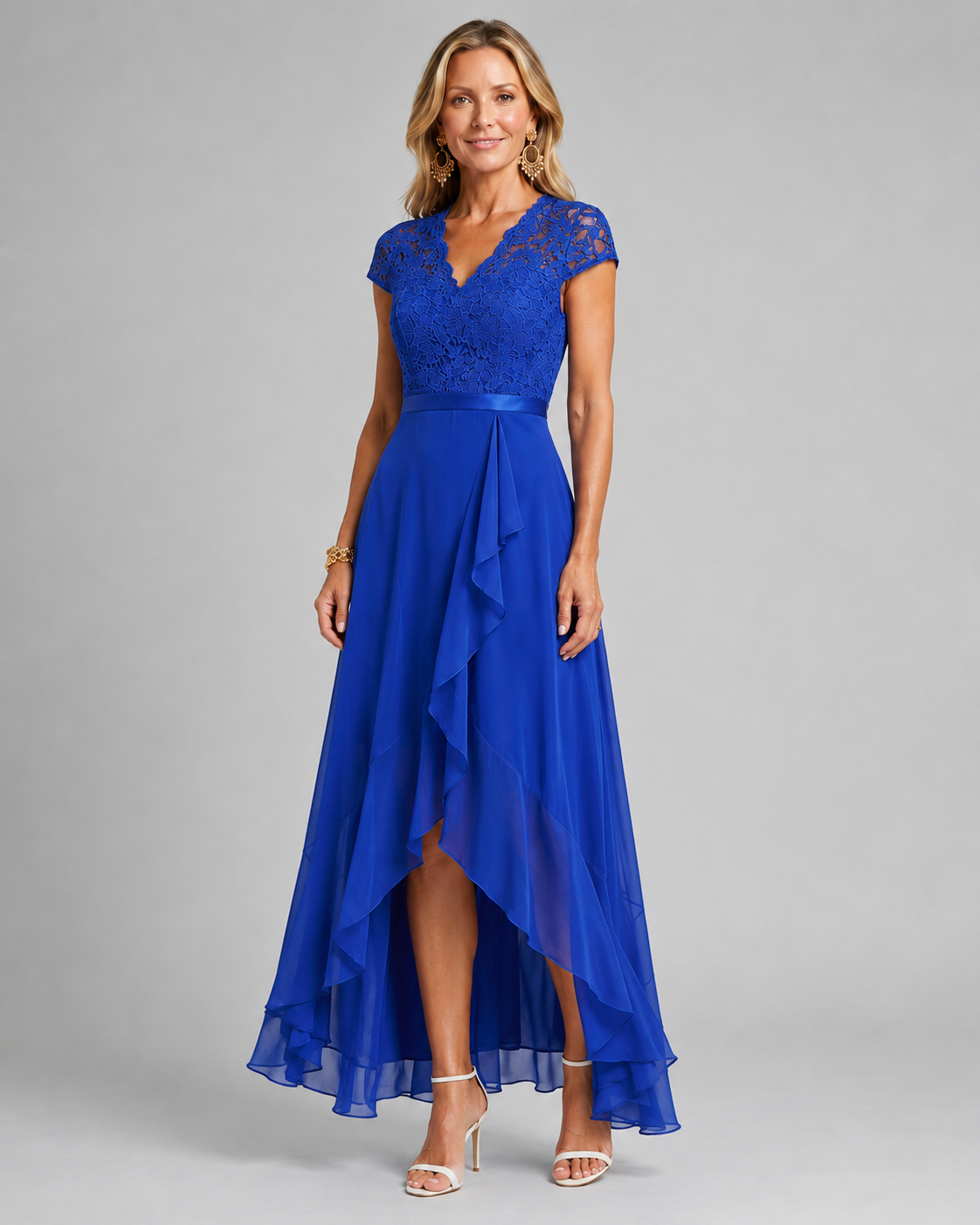 Blue lace evening dress with cap sleeves, sash waist, and asymmetrical ruffle hem