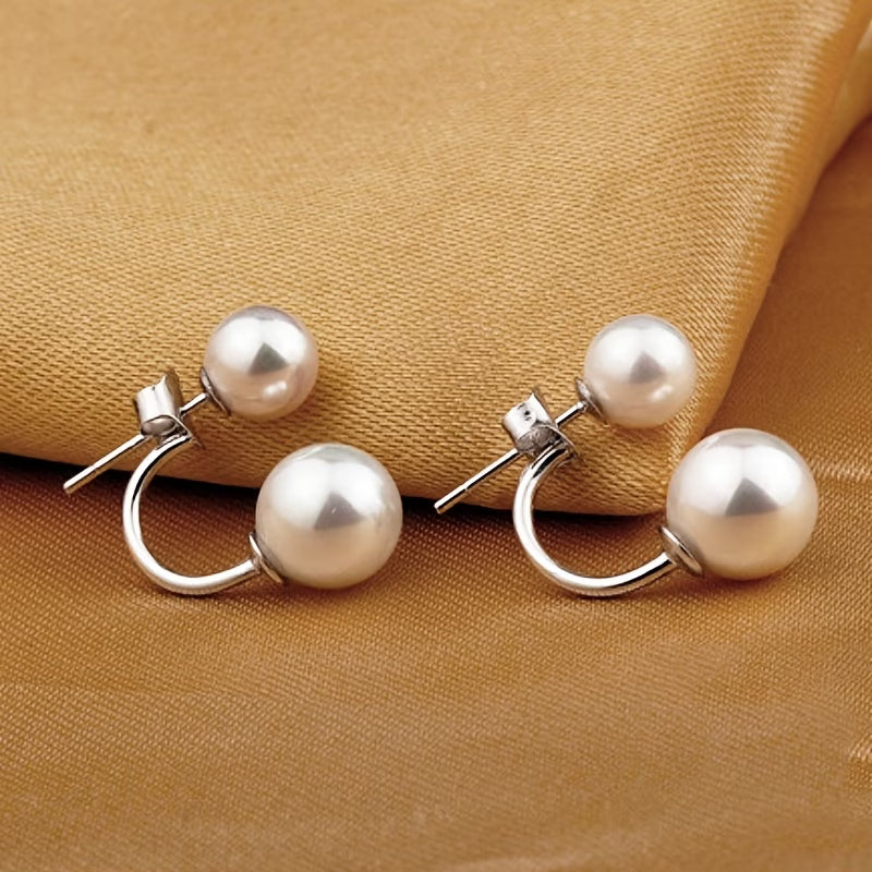 Double-pearl hoop earrings with two white pearls and silver hinged hoops
