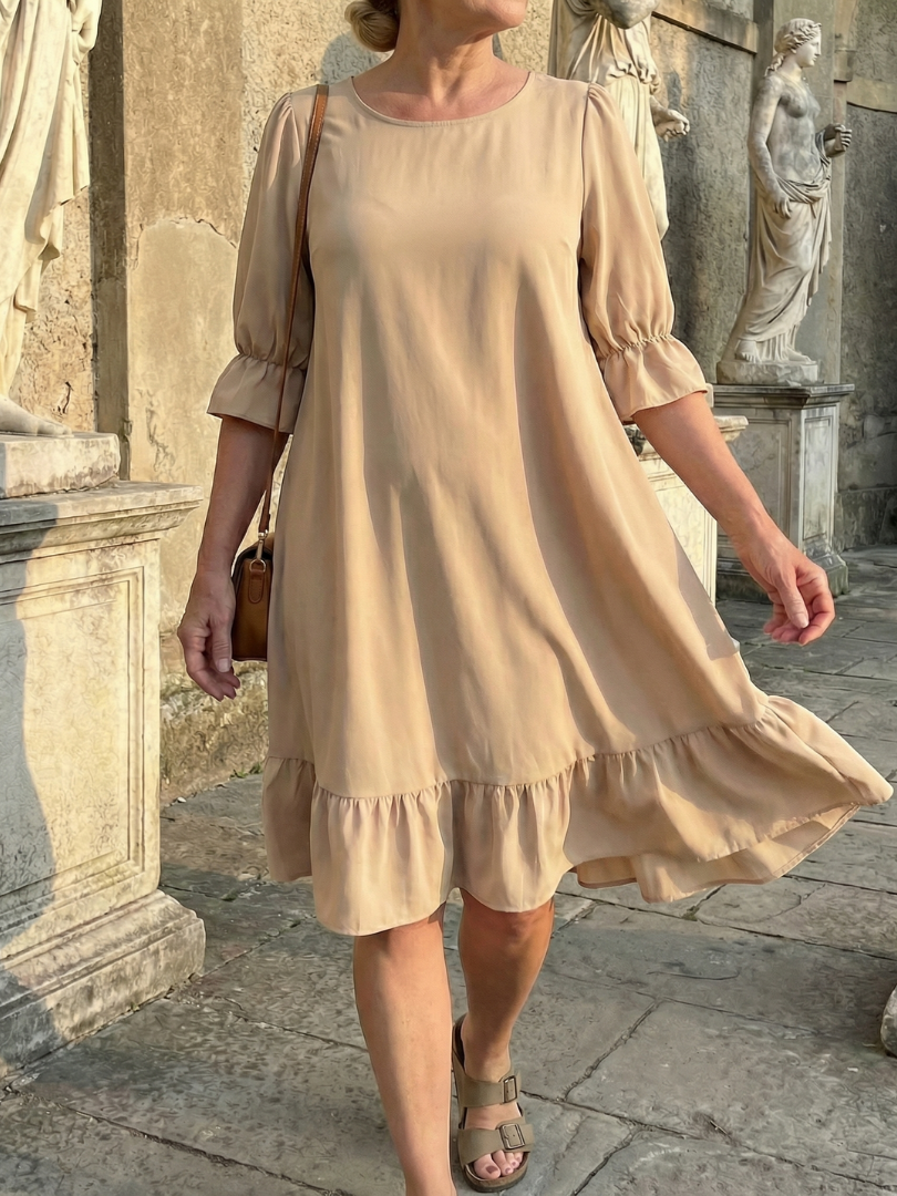 Beige ruffle day dress with gathered waist seam and tiered ruffle hem
