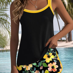 Two-piece beach tankini set with black tank top and yellow trim floral shorts