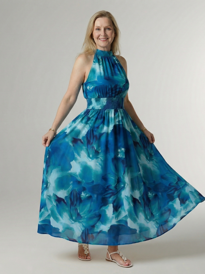 Blue gathered halter midi dress with smocked waist and flowing tiered skirt