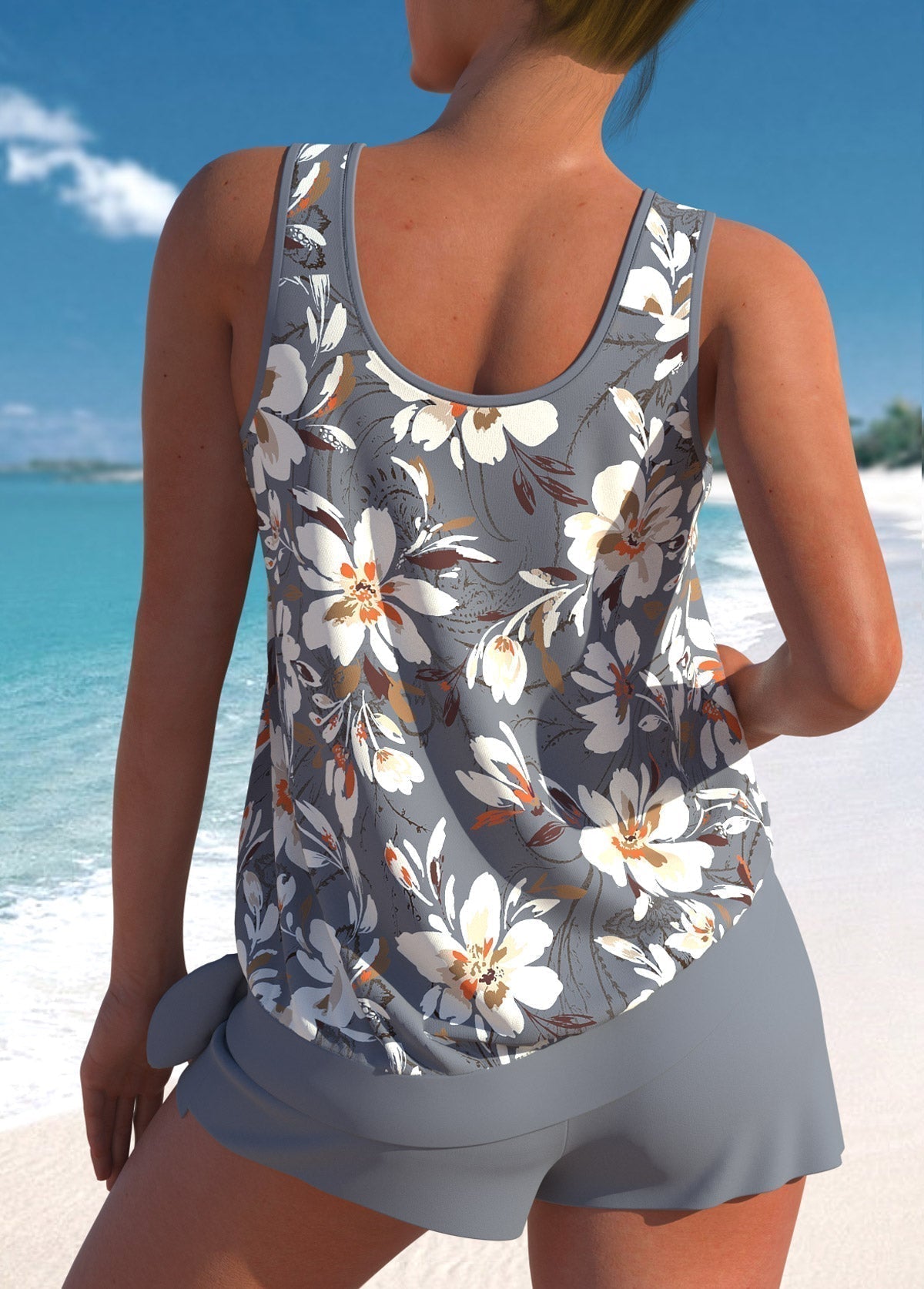 Grey tankini top with scoop back and floral print, paired with swim shorts