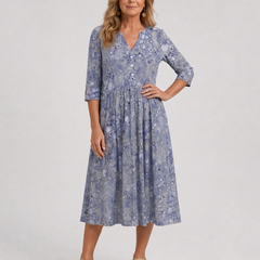 Blue floral midi dress with V-neck and three-quarter sleeves with button detailing