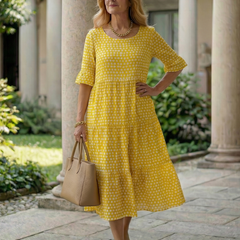 Yellow polka dot tiered midi dress with short sleeves and gathered skirt