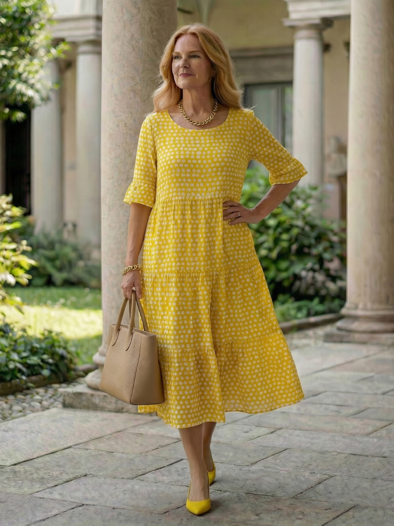 Yellow polka dot tiered midi dress with short sleeves and gathered skirt