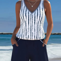 Navy two-piece V-neck swimsuit set with white vertical tie-dye stripe top and shorts
