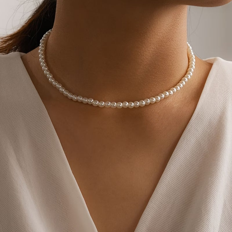 Single strand pearl bead necklace with round beads around the neck