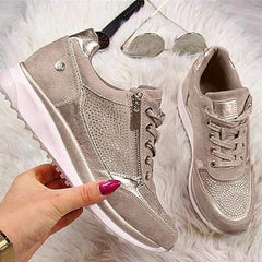 Beige metallic zip-up comfort sneaker pair, lace-up front and side zipper