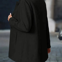 Black back view tailored coat with rounded button details and long sleeves