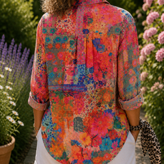 Colorful floral button-up blouse, back view with collar and rolled sleeves