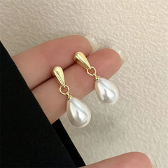 Gold hoop pearl drop earrings with large white teardrop pearls