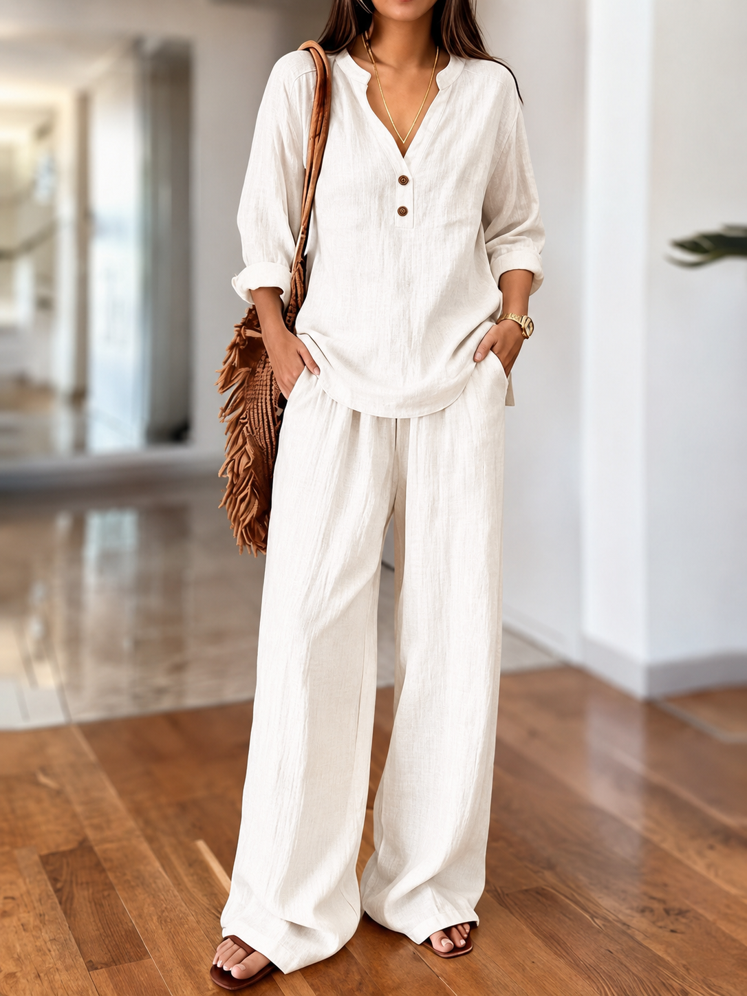 White long-sleeve two-piece set with V-neck tunic top and relaxed wide-leg pants
