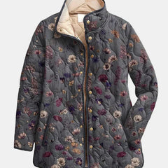 Quilted floral print jacket in dark gray with multicolor flowers; hood and snap buttons