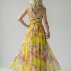 Back view of yellow multicolor soft-wrap maxi dress with cross-back straps