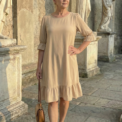 Beige ruffle day dress with tiered ruffle hem and short puff sleeves
