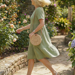 Green woven ease dress with V-neck and tiered skirt, short sleeves