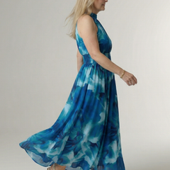 Blue gathered halter midi dress, side view, smocked bodice and full skirt