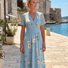 Light blue V-neck midi dress with yellow-and-white floral print and cinched waist