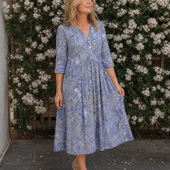 Blue floral midi dress with V-neck, button front, and gathered midi skirt