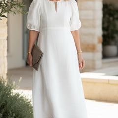 Soft white maxi dress with puff sleeves and keyhole neckline, gathered waist fit.
