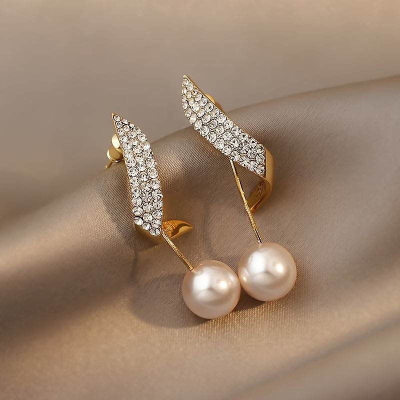 Crystal feather pearl earrings with pavé leaf design and two pearl drops