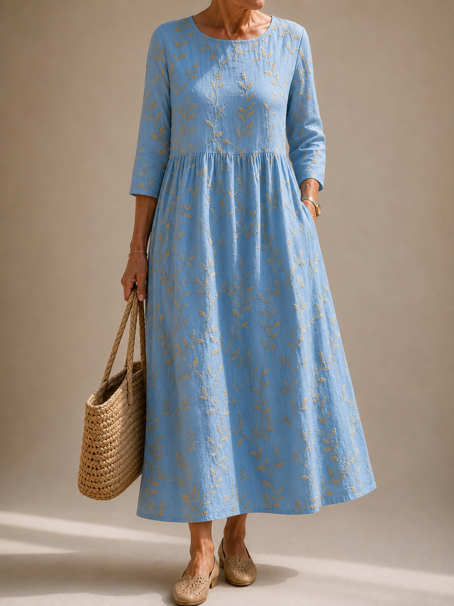 Light blue long-sleeve flower dress with gathered waist and full skirt