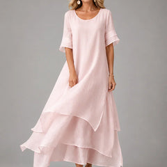 Pink cotton ruffle midi dress with short sleeves and layered tiered hem