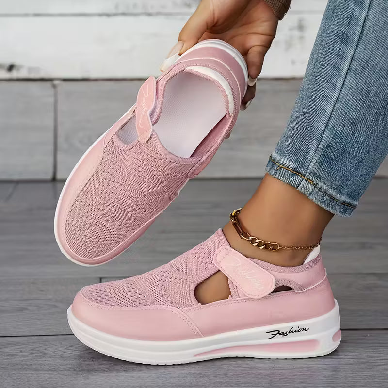 Pink comfort sneakers with perforated upper, side cutout, and white sole
