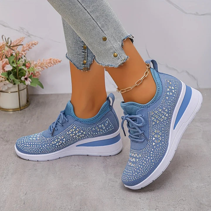 Blue knit lace-up comfort sneakers with diamond cutout pattern and white sole